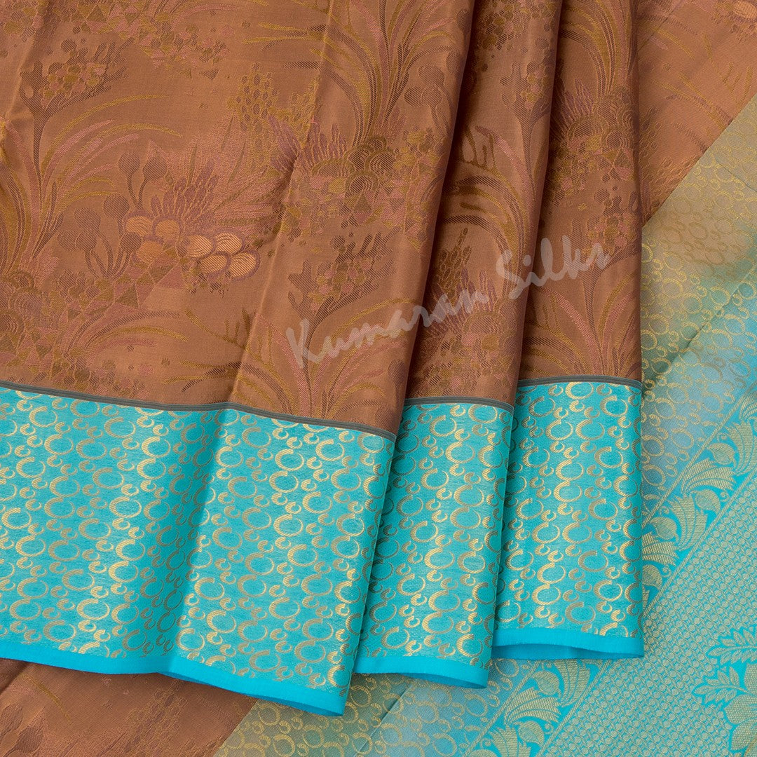 Brown Silk Saree With Floral Motif And Blue Border - Kumaran Silks