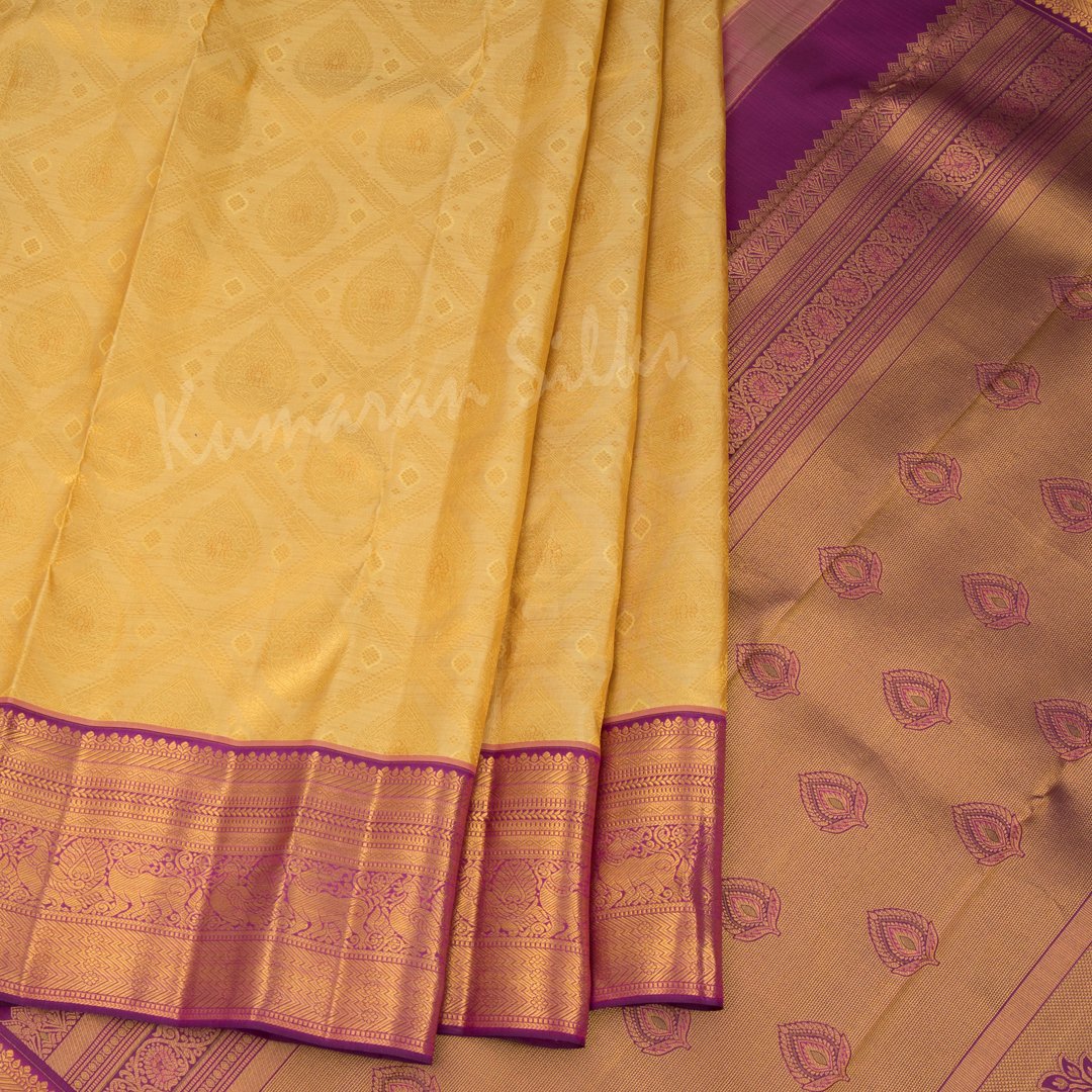 Golden Yellow Brocade Silk Saree And Gold Zari Border