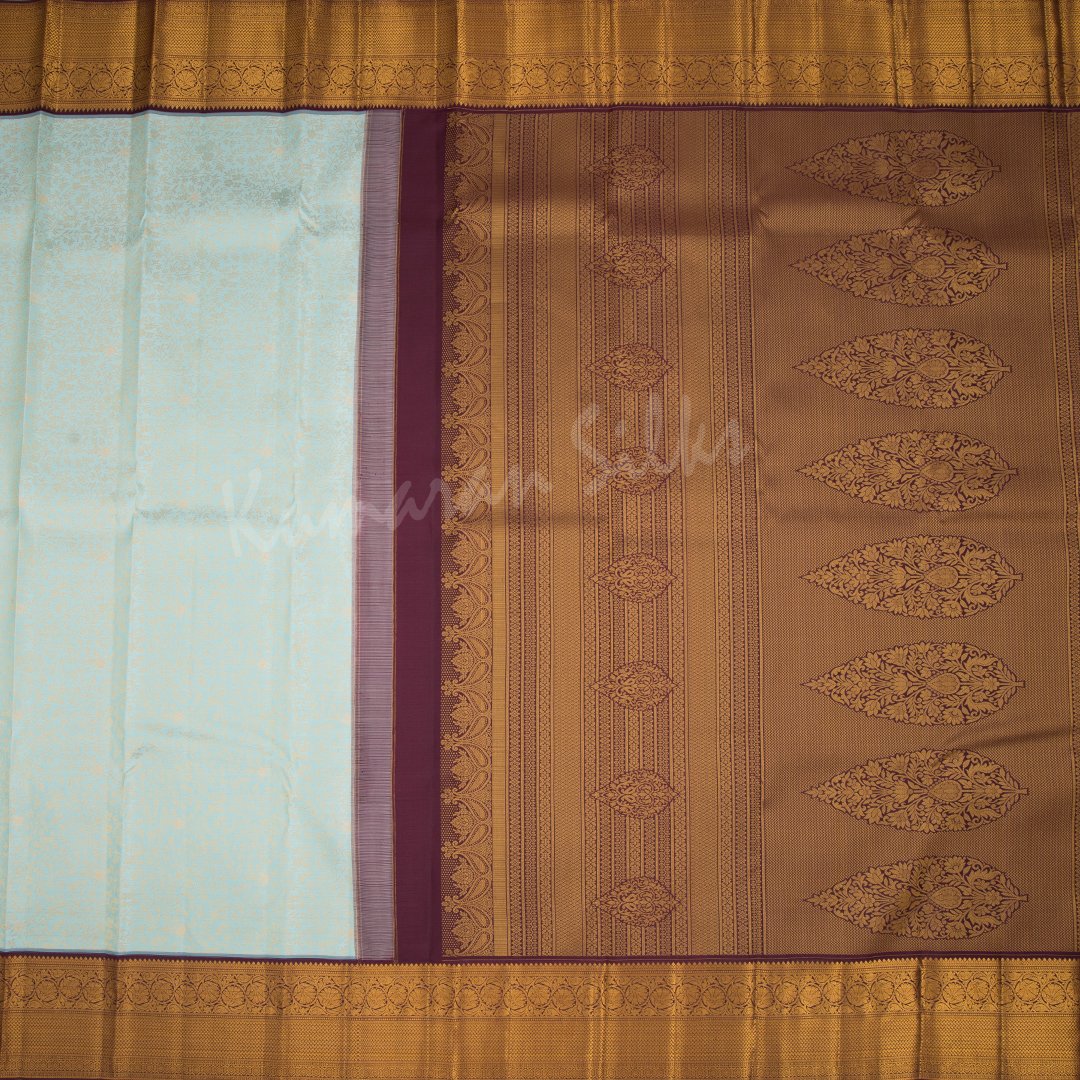 Powder Blue Silk Saree With Floral Motif And Maroon Zari Border