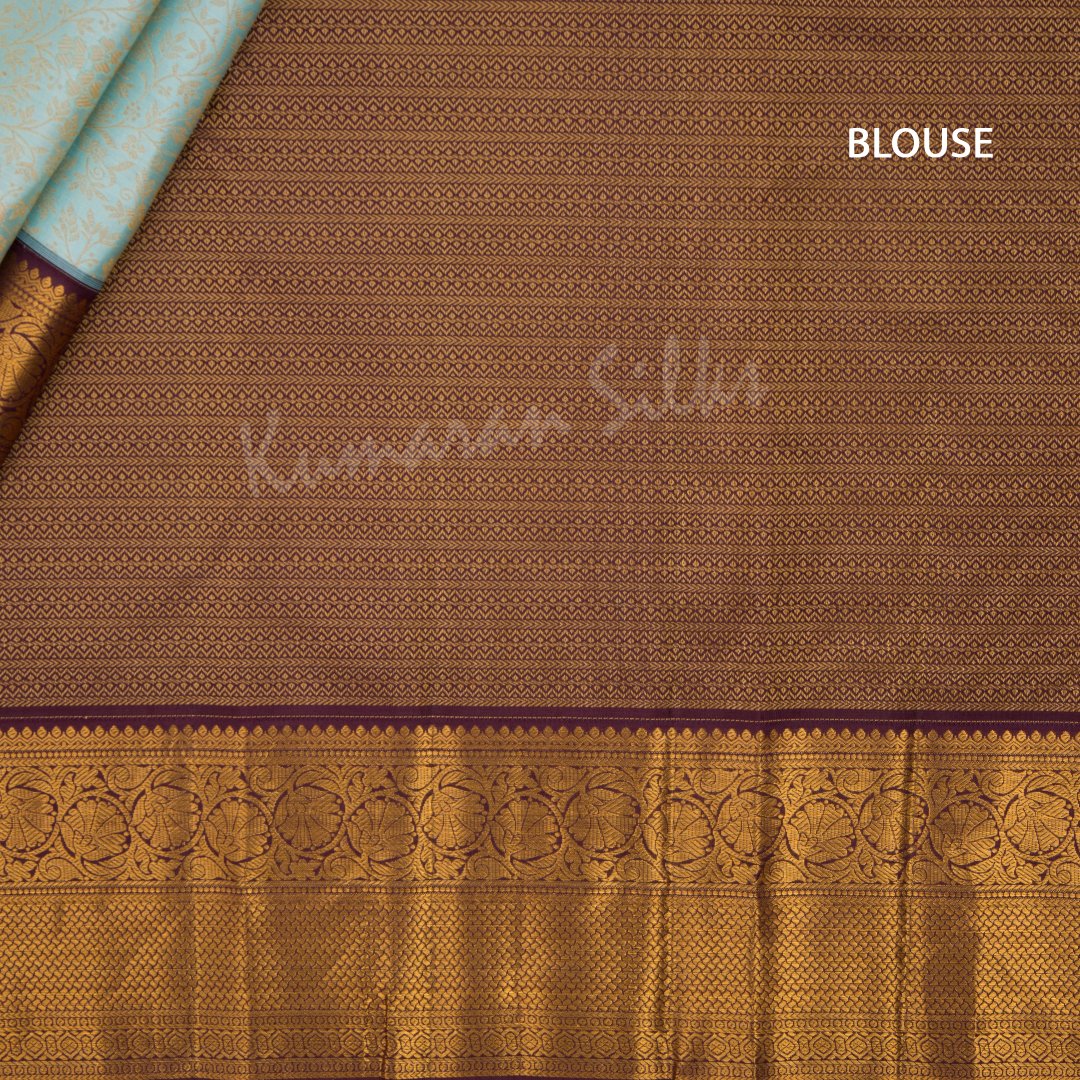 Powder Blue Silk Saree With Floral Motif And Maroon Zari Border