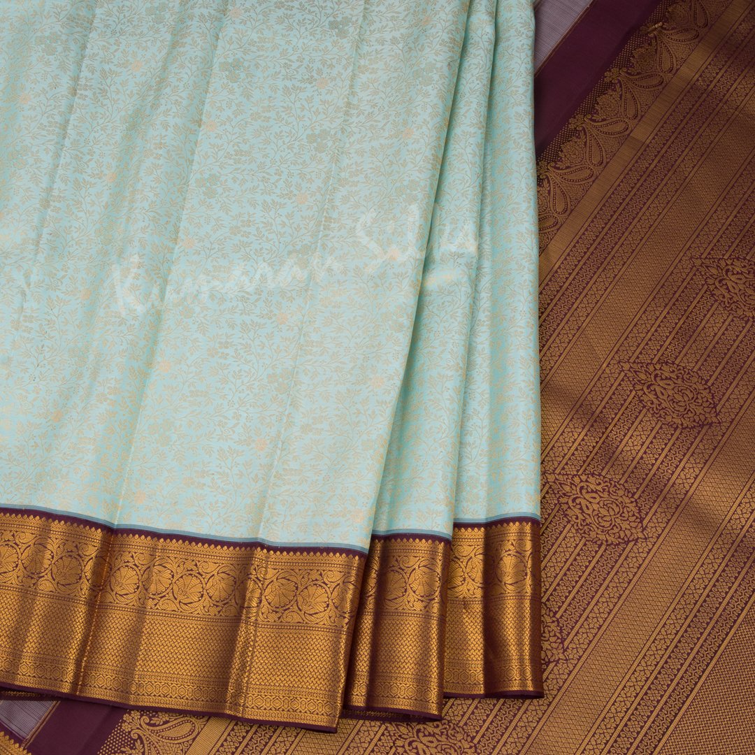 Powder Blue Silk Saree With Floral Motif And Maroon Zari Border