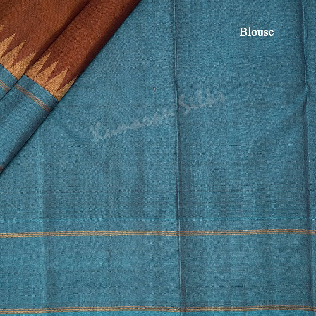 Cinnamon Brown Plain Silk Saree And Temple Design On Blue Border - Kumaran Silks