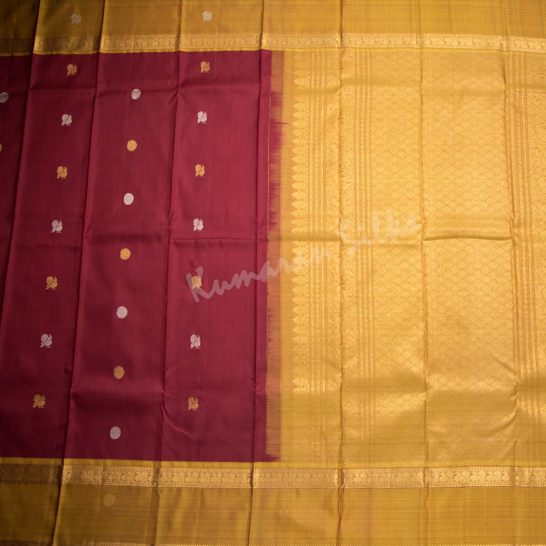 Maroon Silk Saree With Peacock And Chakra Buttas And Rettapet Border