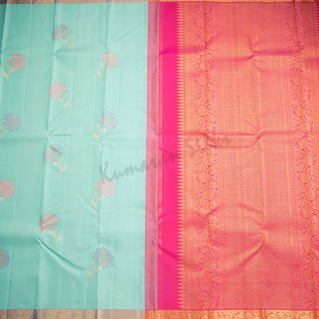 Turquoise Blue Silk Saree With Floral Design And Small Zari Border