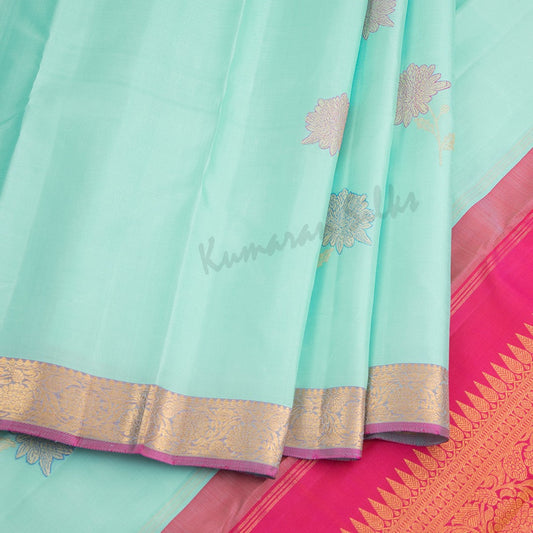 Turquoise Blue Silk Saree With Floral Design And Small Zari Border