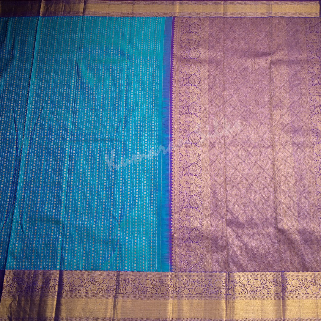 Peacock Blue Silk Saree With Vertical Zari Buttas And Purple Zari Border