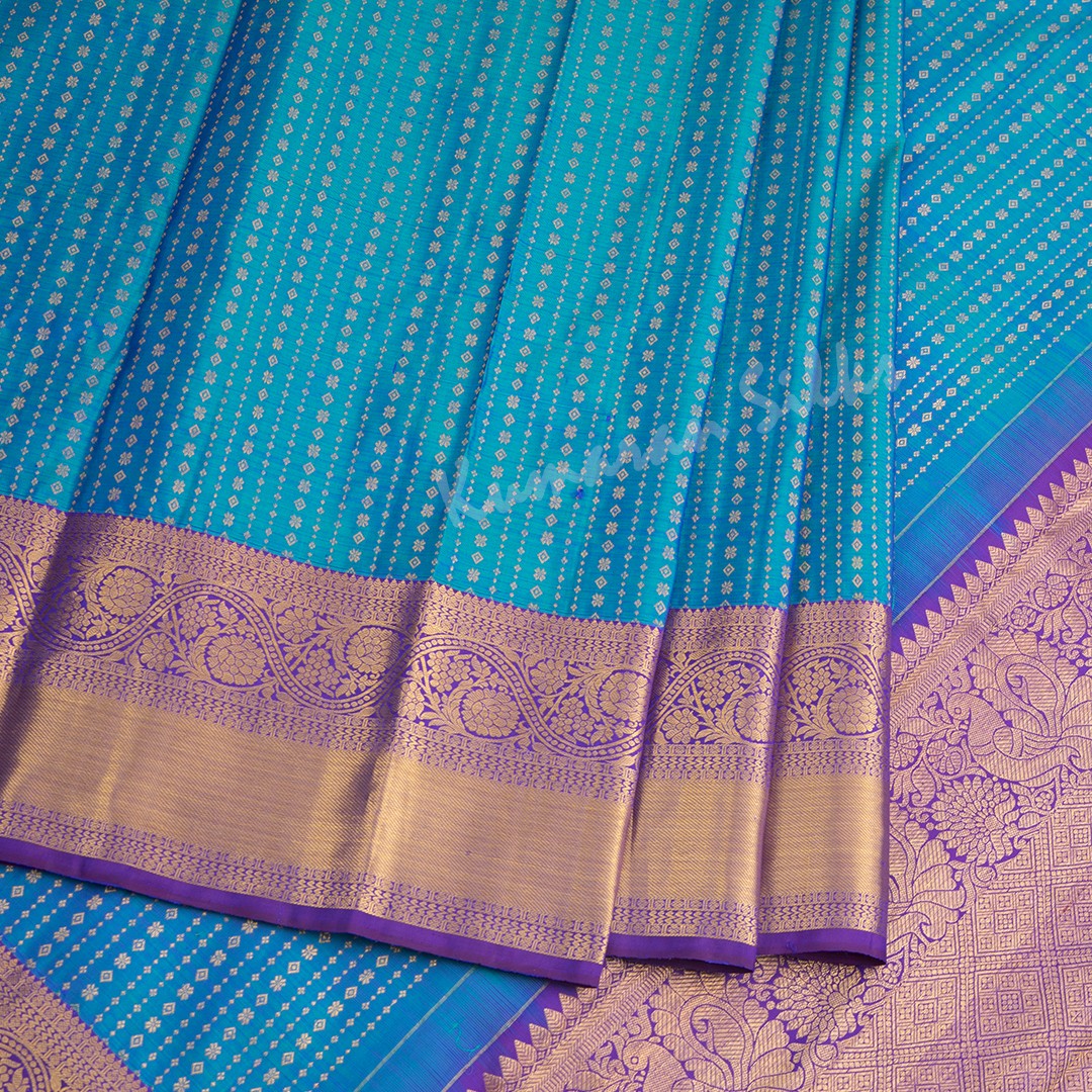 Peacock Blue Silk Saree With Vertical Zari Buttas And Purple Zari Border