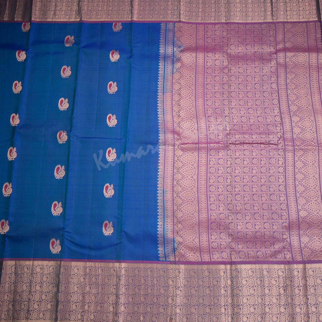 Peacock Blue Silk Saree With Peacock Zari Buttas And Copper Zari Border