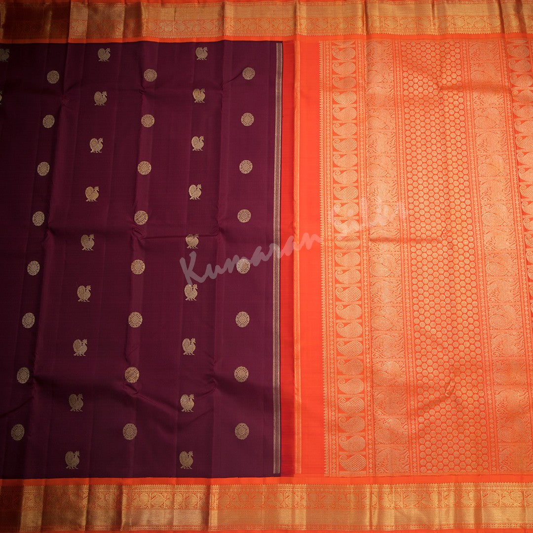 Maroon Silk Saree With Peacock And Chakra Buttas And Orange Zari Border