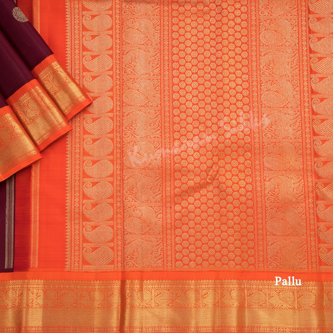 Maroon Silk Saree With Peacock And Chakra Buttas And Orange Zari Border