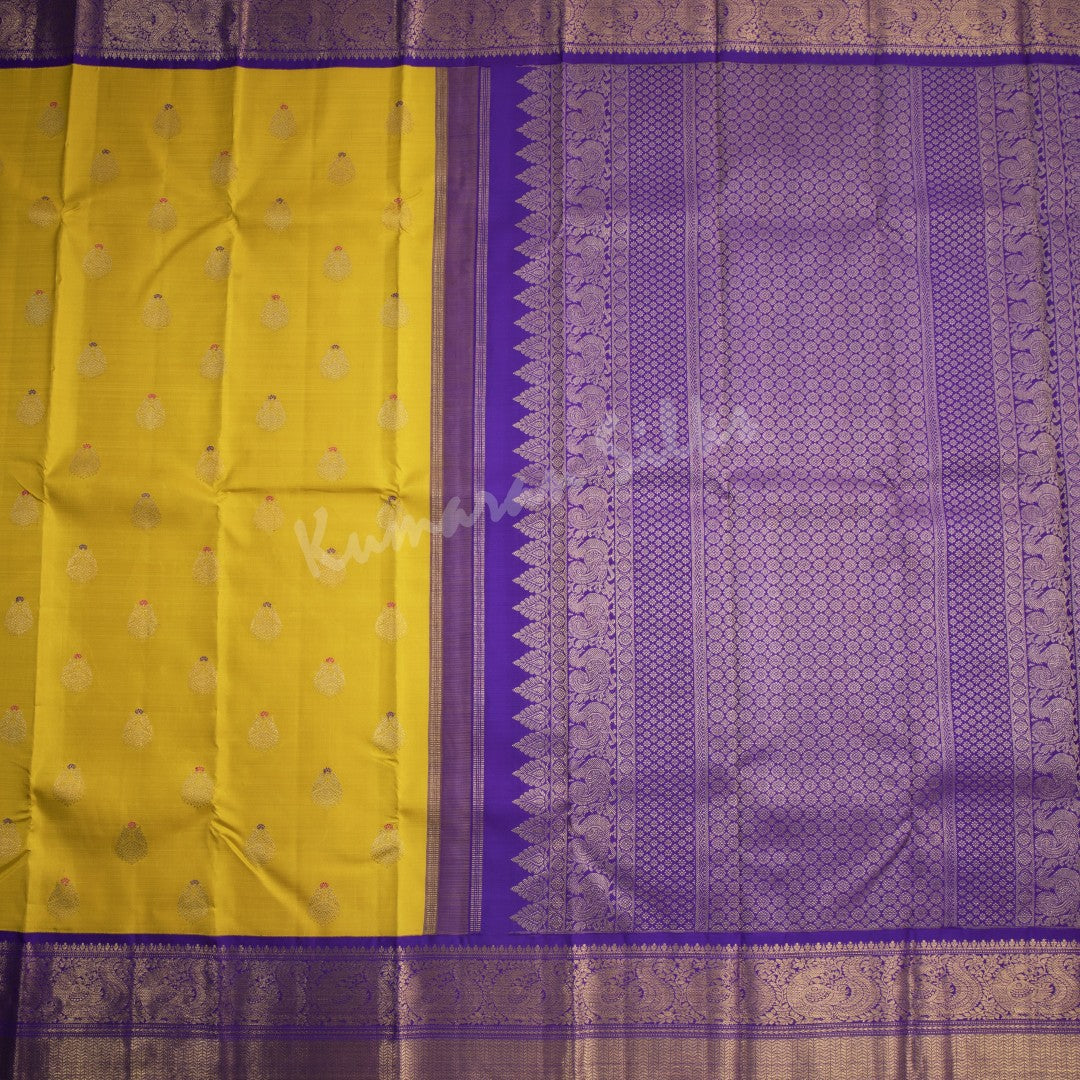 Mustard Yellow Silk Saree With Peacock Zari Buttas And Purple Zari Border