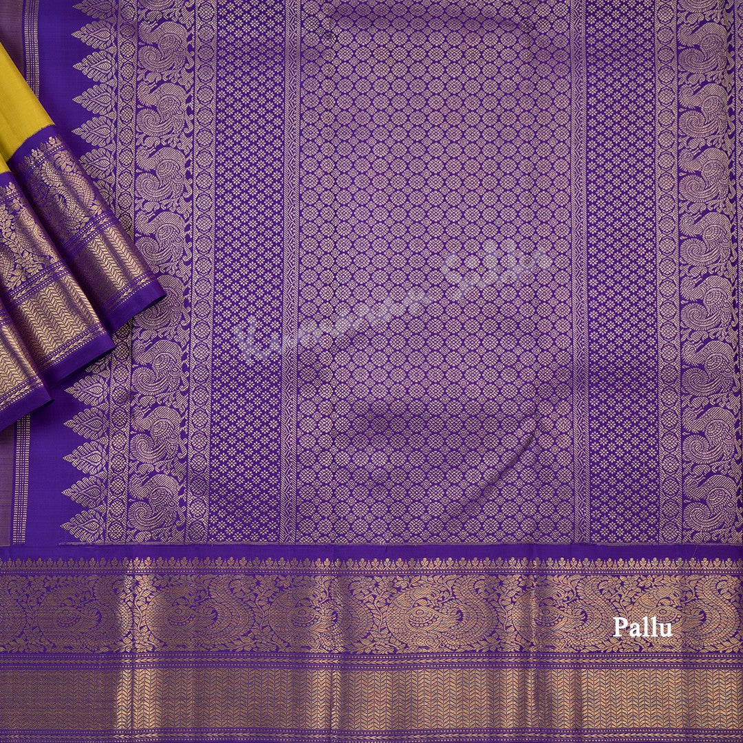 Mustard Yellow Silk Saree With Peacock Zari Buttas And Purple Zari Border