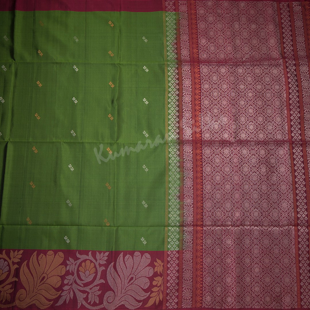 Olive Green Soft Silk Saree With Silver And Gold Buttas And Floral Border