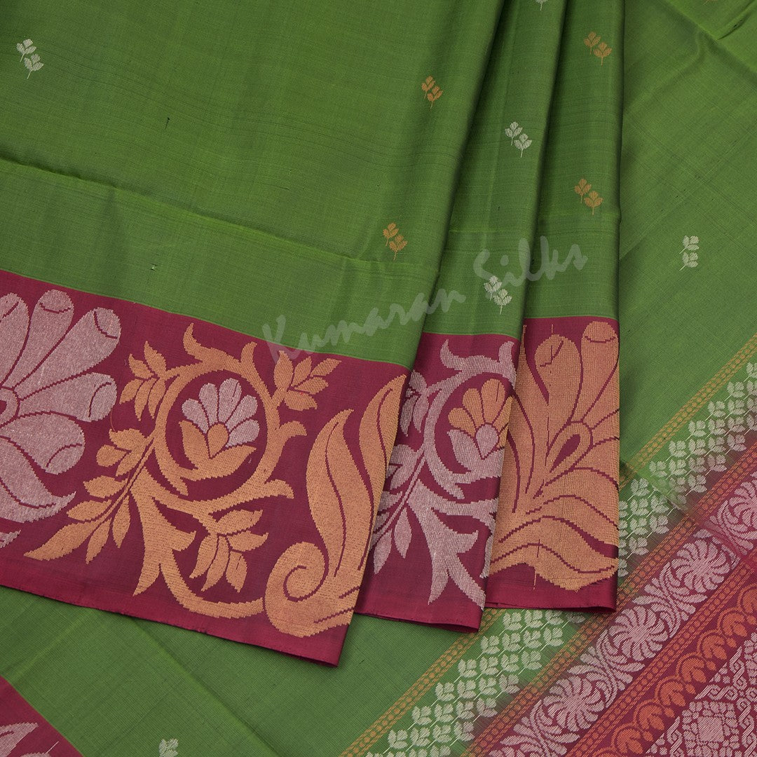 Olive Green Soft Silk Saree With Silver And Gold Buttas And Floral Border