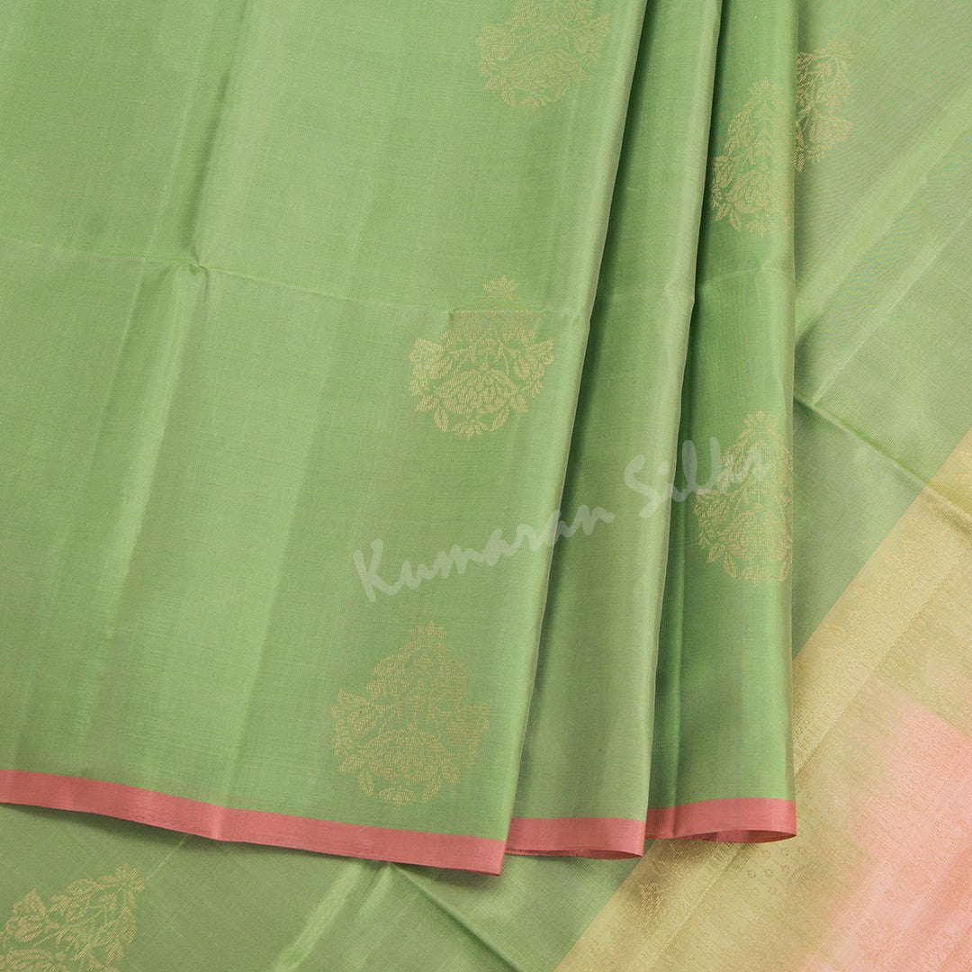 Light Green Soft Silk Saree With Floral Zari Buttas And Ribbon Border