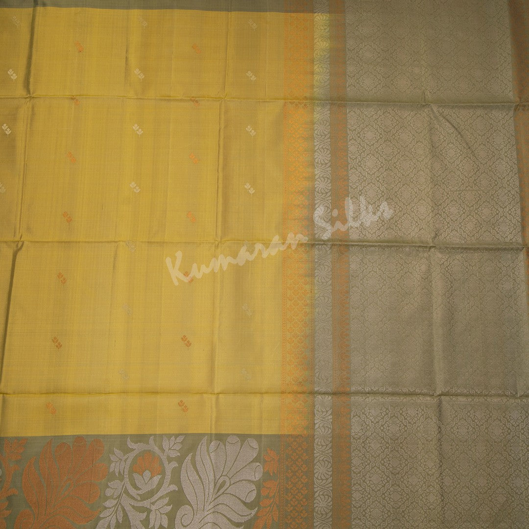 Golden Yellow Soft Silk Saree With Silver And Copper Buttas And Floral Border