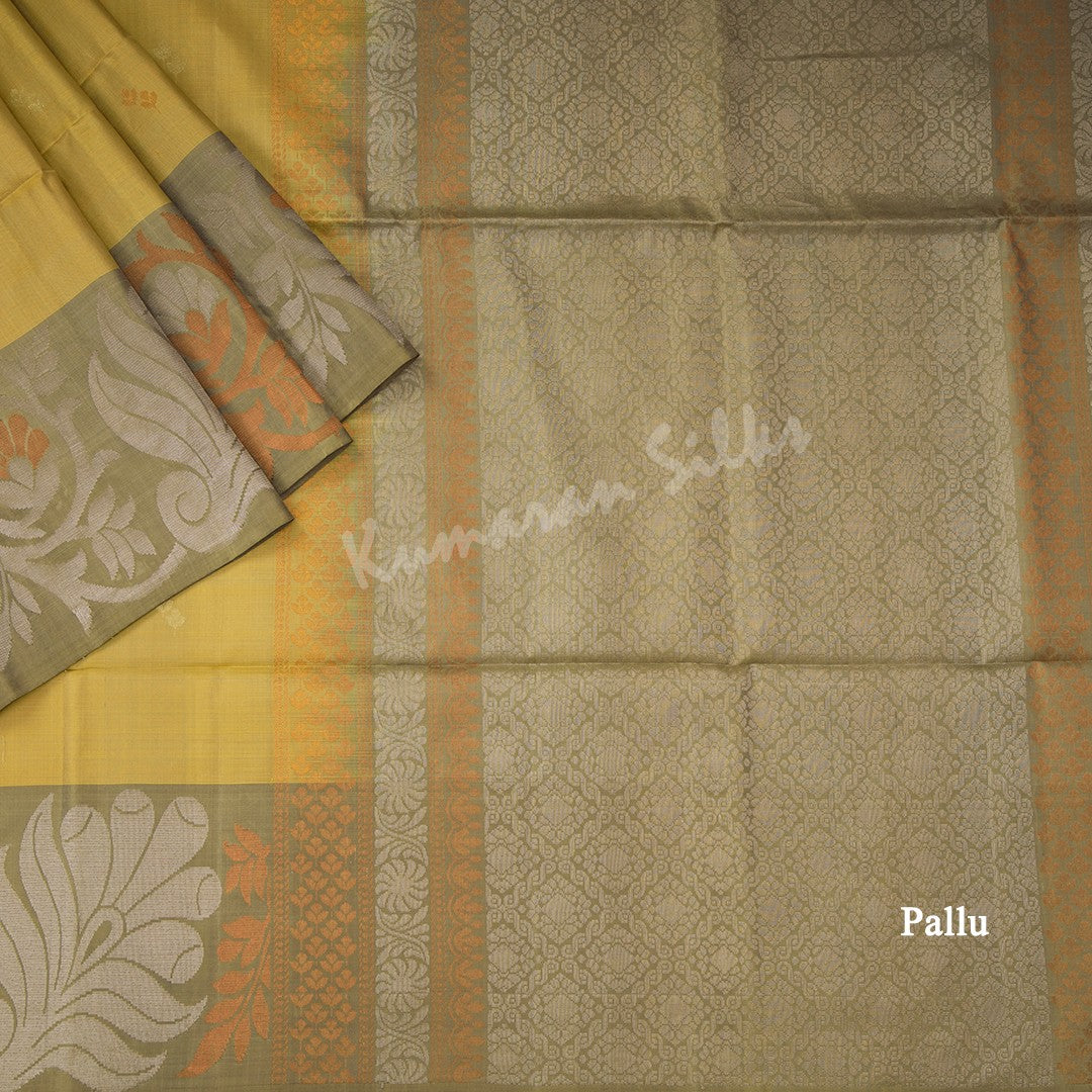 Golden Yellow Soft Silk Saree With Silver And Copper Buttas And Floral Border