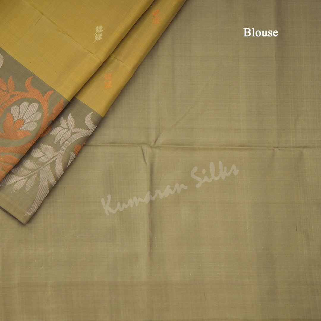 Golden Yellow Soft Silk Saree With Silver And Copper Buttas And Floral Border