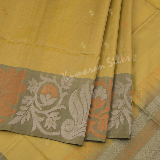 Golden Yellow Soft Silk Saree With Silver And Copper Buttas And Floral Border