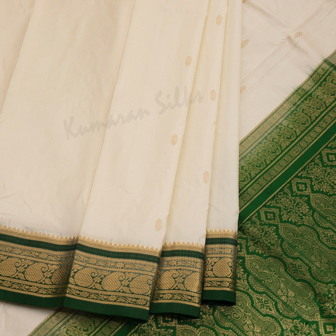 Pure Silk Cream Saree With Gold Zari Buttas And Contrast Border - Kumaran Silks