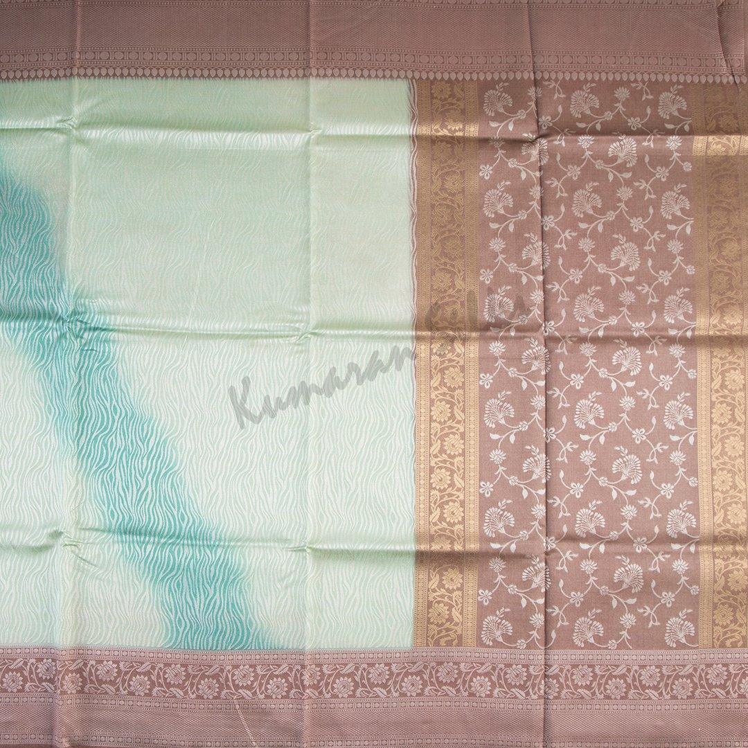 Semi Raw Silk Embossed Light Green Saree With Brown Border - Kumaran Silks