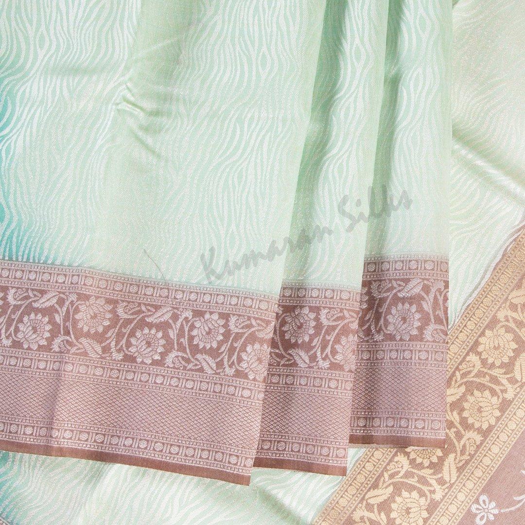 Semi Raw Silk Embossed Light Green Saree With Brown Border - Kumaran Silks