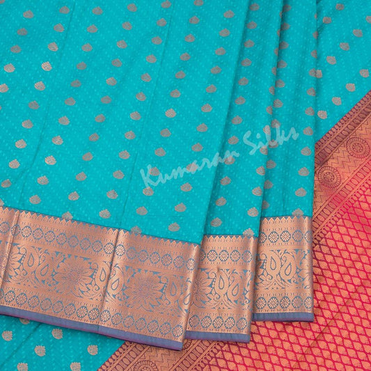 Art Silk Peacock Blue Saree With Small Buttas On The Body - Kumaran Silks