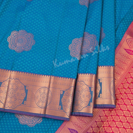 Art Silk Peacock Blue Saree With Floral Buttas And Zari Border - Kumaran Silks