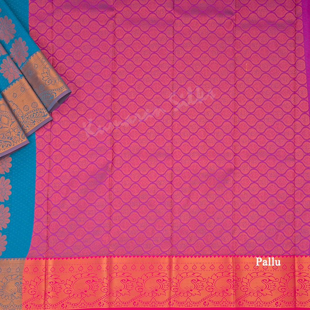 Art Silk Blue Saree With Embossed Design And Zari Buttas