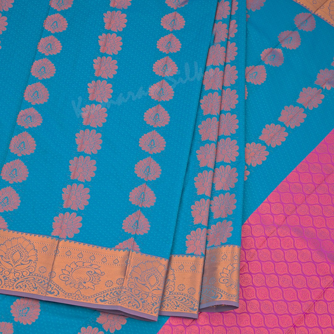 Art Silk Blue Saree With Embossed Design And Zari Buttas