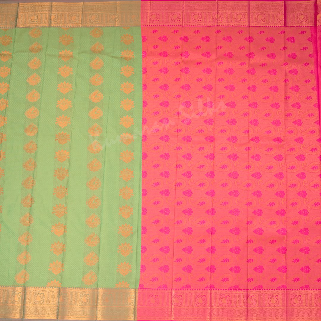 Art Silk Light Green Saree With Embossed Design And Zari Buttas