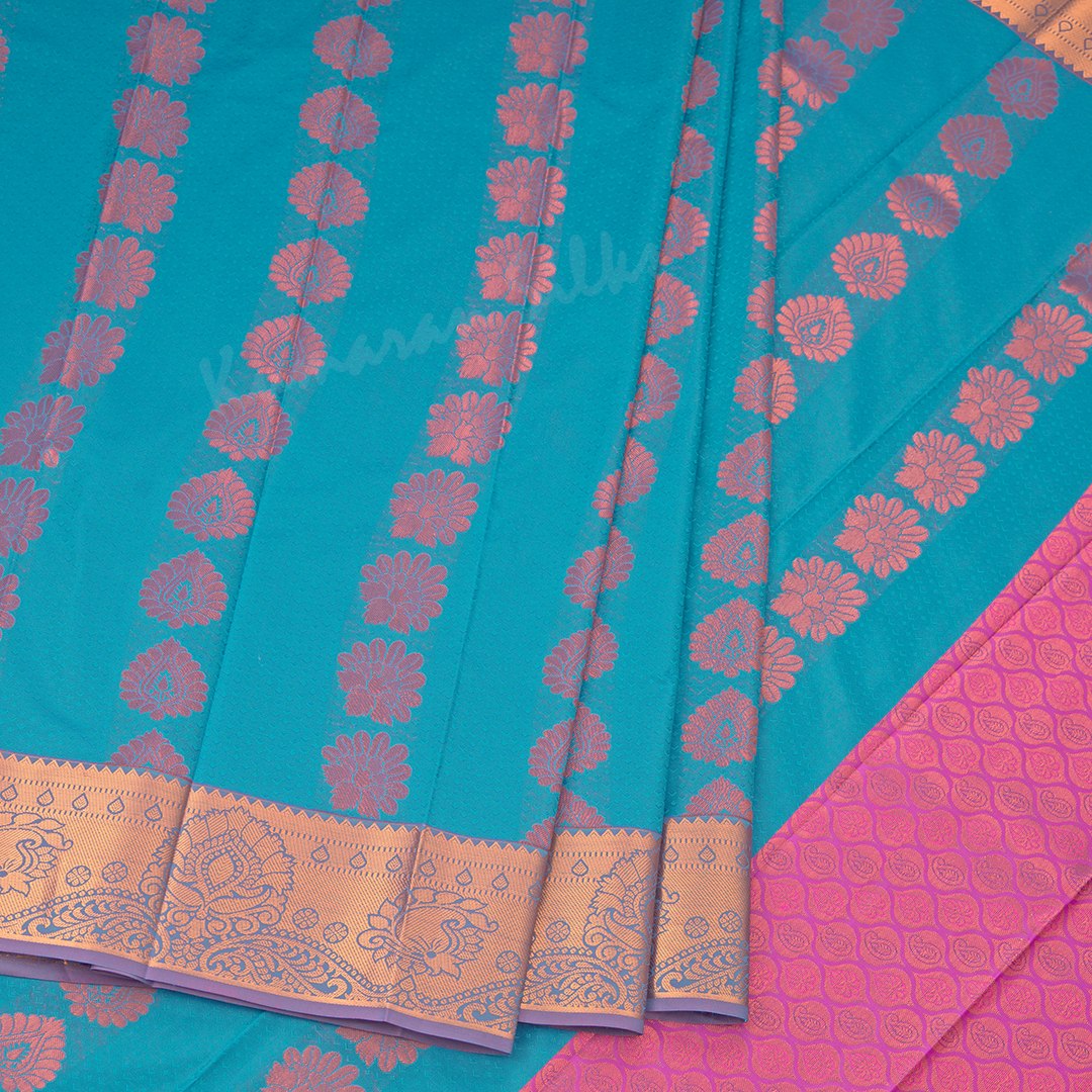 Art Silk Peacock Blue Saree With Embossed Design And Zari Buttas 02