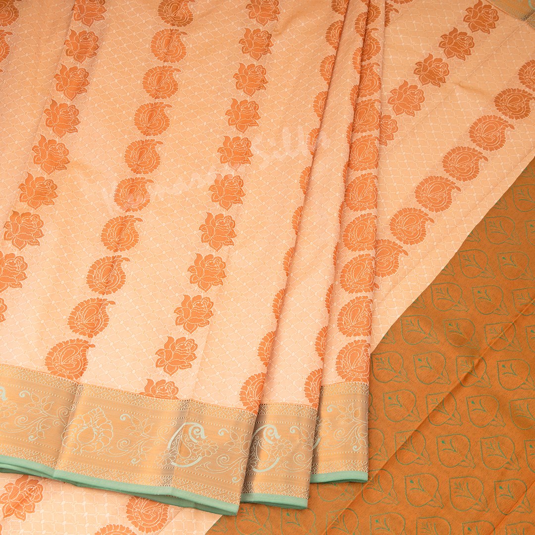 Art Silk Light Peach Saree With Embossed Design And Zari Buttas