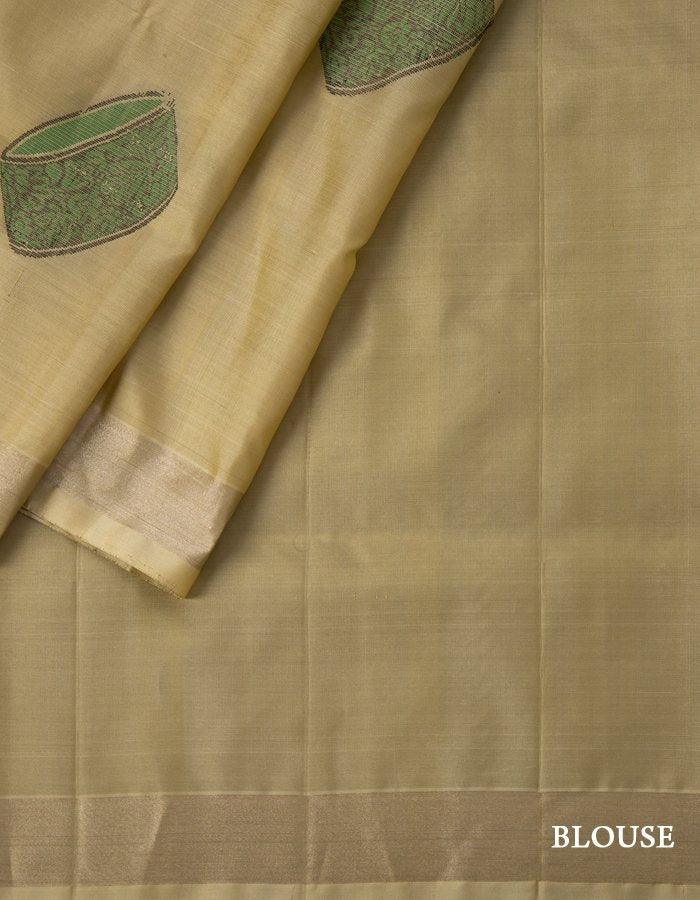 Beige Soft Silk Saree With Green Instrument Patterned Thread Work - Kumaran Silks