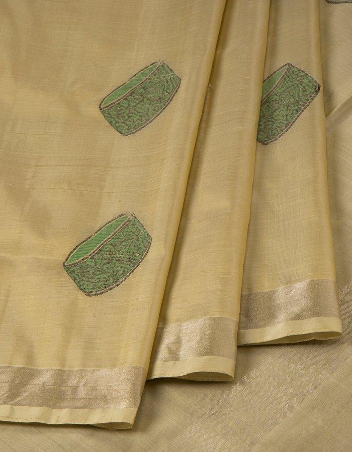 Beige Soft Silk Saree With Green Instrument Patterned Thread Work - Kumaran Silks