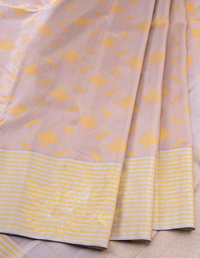 Beige Silk Saree With Stylish Yellow Patterns Adorning The Body And Grey Zari Border - Kumaran Silks