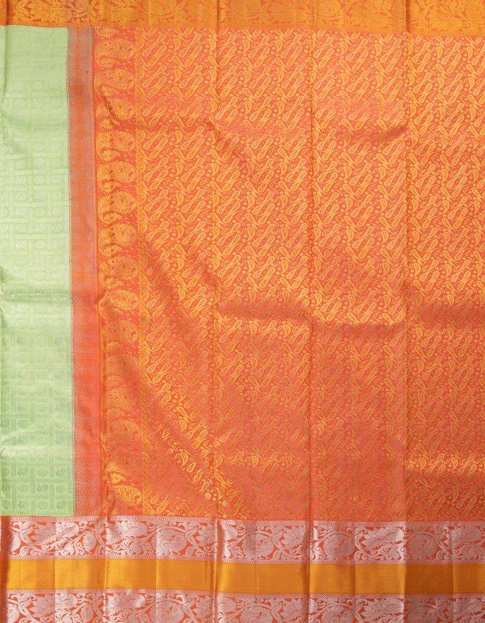 Light Green Self Designed Silk Saree With Orange Border And Gold And Silver Zari Work - Kumaran Silks